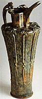 Side view of ribbed bronze flagon.
