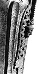 Detail side view of head and openwork at base of handle.