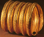 Gold bracelet, found (unusually) on the right arm of the deceased.