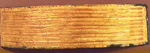 Belt: Gold foil with linear stamped designs, sewn onto original bronze belt cover.