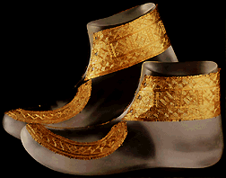 gold shoe ornaments, over modern synthetic shoe reconstructions.