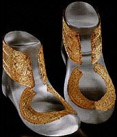 gold shoe ornaments, over modern synthetic shoe reconstructions.