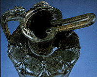 Detail of top part  of bronze flagon.