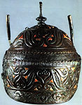 Iron, bronze & coral helmet found
			at  Canosa di Puglia. 4th c. BCE.